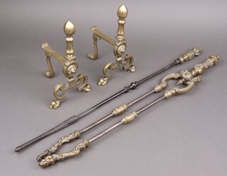A pair of 19th/20th Century polished steel fire tongs, poker and a pair of brass fire dogs 