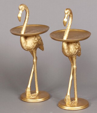 A pair of gilt painted resin wine tables in the form of standing flamingoes 74cm h x 30cm diam.
