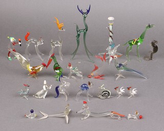 A collection of glass figures of animals including cats 