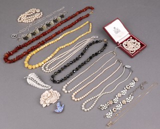 A collection of costume jewellery including necklaces, beads, brooches etc 