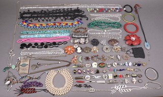 A collection of costume jewellery including brooches, etc