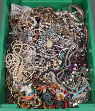 A collection of costume jewellery including bangles, necklaces, beads, brooches etc 
