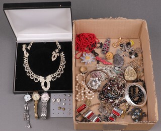 A collection of costume jewellery including a diamonte necklace and earrings boxed, other necklaces, etc 