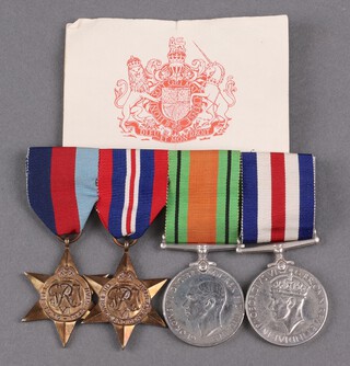 A group of 4 medals comprising 1939-45 Star, France and German Star, Defence and War medal, mounted, together with a certificate 