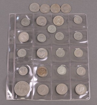 A collection of various sixpences and other coins 