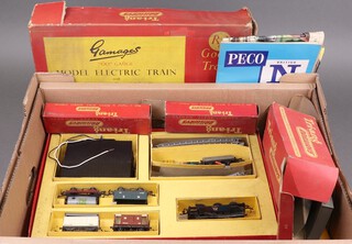 A Triang OO gauge electric model train set R3G Goods Train, boxed together with a small collection of rolling stock, 2nd Edition Triang Railways brochure and other brochures 