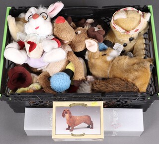 A collection of cuddly toys contained in a plastic box 