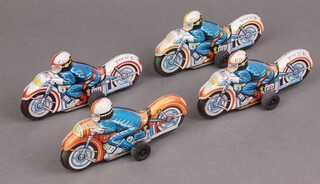 Three Japanese tin plate model Police motorcycles and 1 other, contained in a yellow plastic box 