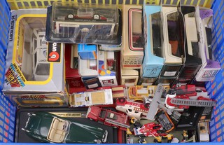 A collection of model vehicles including Burago, Corgi and others, contained in a yellow plastic box  