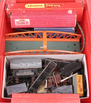 A collection of Hornby Dublo 2 and 3 rail goods wagons including Royal Mail set, Triang Hornby R55 diesel Pullman motor car, all contained in a red plastic box 