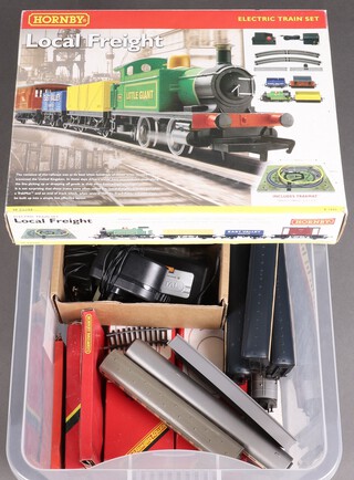 A Hornby OO gauge light freight electric train set boxed, various carriages and controllers, contained in a clear plastic box   
