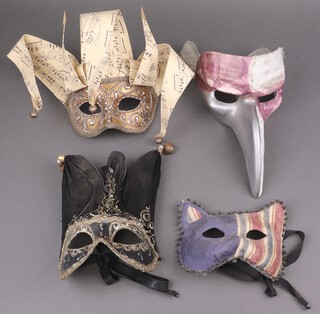 Four decorative Venetian style masquerade face masks