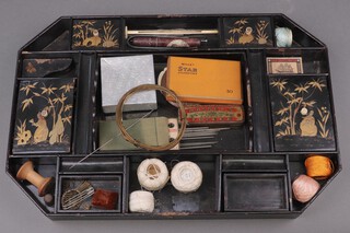 A Regency lacquered lozenge shaped tray removed from a sewing box fitted numerous compartments 5cm high x 48cm wide x 32cm d 