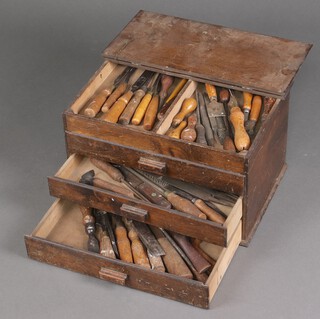 A plywood tool chest containing chisels and files 28cm h x 48cm w x 32cm d 