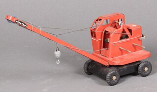 A red Triang crane