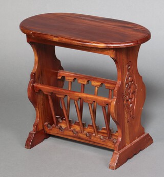 An oval hardwood Canterbury table with carved panels to the side 52cm h x 59cm w x 32cm d