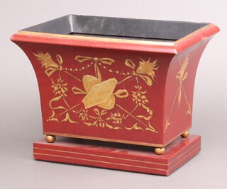A Regency style rectangular red and gilt painted metal planter of waisted form with floral decoration, on bun feet 24cm high x 30cm w x 22cm d (slight dent to 1 side) 