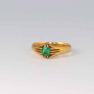 A gold testing as 18ct emerald set signet ring, size L,  initialled W.M and dated 1918, 4.2g