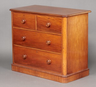 A Victorian bleached mahogany D shaped chest of 2 short and 2 long drawers with turned handles, raised on a platform base 91cm h x 107cm w x 57cm d 