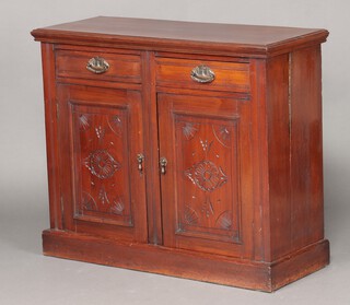 An Edwardian walnut chiffonier fitted 2 short drawers above double cupboard enclosed by panelled doors, raised on a platform base 86cm h x 86cm w x 40cm d 