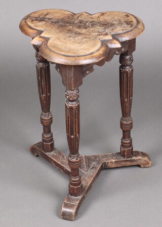 A Victorian bleached mahogany clover shaped table, raised on turned and fluted supports with shaped stretcher 54cm h x 39cm w x 36cm d 