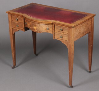 An Edwardian inlaid rosewood bow front writing table with inset green writing surface, fitted 1 long and 2 short drawers, raised on square tapered supports 72cm h x 89cm w x 52cm d 
