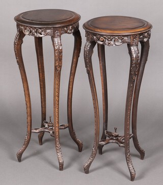 A near pair of Edwardian style circular pierced beech jardiniere stands, raised on cabriole supports with X framed stretchers, decorated lidded urns 78cm high x 38cm diam. 