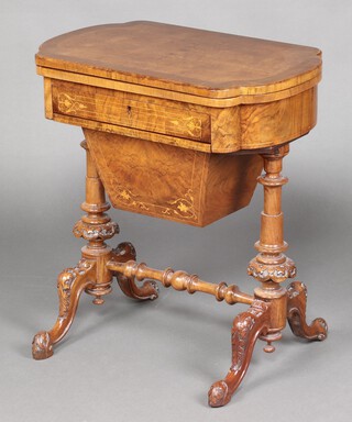 A Victorian quarter veneered and crossbanded work/games table table, the flip over top inlaid a chess, cribbage and backgammon board, the base fitted a drawer above deep basket, raised on carved turned supports with H framed stretcher 70cm h x 64m w x 40cm d 