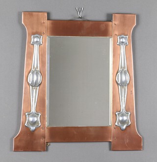 A Liberty style Arts & Crafts rectangular bevelled plate mirror contained in a shaped copper frame 47cm x 44cm 