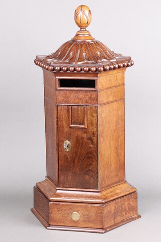 A Victorian and later oak internal post or letter box of hexagonal pillar form in Penfold design, with brass fitting though later hinges and lock, internal leather lined, mounted "Walter Thornhill" retail plaque numbered 436 and date mark for 1871, missing letter flap. 60cm h x 32cm x 28cm 