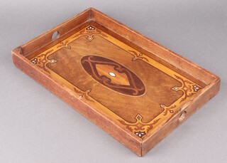 A World War One, prisoner of war made, rectangular inlaid mahogany tray, the reverse marked Jersey 1917 Wan Gugo Durfel, 4cm h x 43cm w x 27cm d,  NB. The POW camp was at Les Blanches Banques in St. Ouen. 