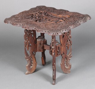 A 19th Century rectangular Eastern carved hardwood card table of shaped outline, raised on pierced supports 65cm h x 77cm w x 63cm d  