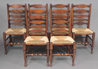 A set of 6 17th Century style elm bar back dining chairs with woven rush seats 