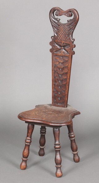 A Victorian carved oak spinning chair with slat back and shaped seat, raised on turned supports 92cm h x 33cm w x 33cm d 