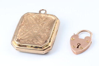 A 9ct engraved gold locket (dented), together with a 9ct gold heart shaped padlock, 5.2g