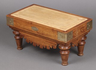 De Kercoet, a beech and fruit wood. French miniature table top butcher's block with bass banding raised on turned supports 27cm h x 54cm w x 30cm d, the brass plaque marked RD De Kercoet Modele Depose 100 