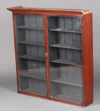 A Victorian mahogany display cabinet with  moulded cornice, fitted adjustable shelves enclosed by arched panelled doors 117cm high x 118cm wide x 27cm d 