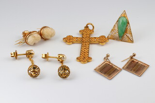 A gold testing as 18ct, pierced Orthodox style cross, 5.4g, a pair of 3 colour gold testing as 9ct diamond shaped earrings 1.1g, a pair of earrings set green cabochon cut hard stones, a pair of cameo earrings and 1 other pair of earrings  