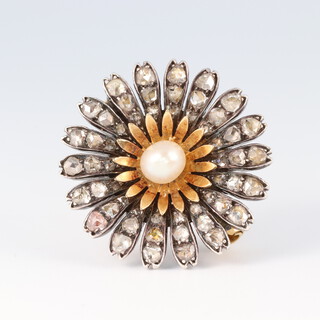 A late 19th Century flowerhead brooch set 36 diamonds with pearl to the centre, 2.5cm diam. 