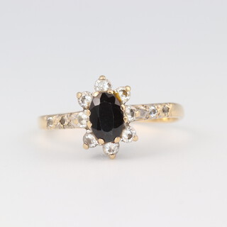 A 9ct gold cluster ring set sapphire and diamonds, size L 1/2, 1.6g 