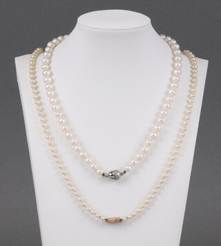 A string of cultured pearls with 9ct gold clasp 66cm together with 1 other cultured pearl necklace 