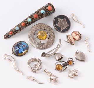 A silver and tortoiseshell Canadian sweetheart brooch, a silver oval butterfly brooch, a pierced gilt metal brooch in the form of a Mandarin's nail guard, a Celtic silver brooch set a hardstone and a quantity of costume jewellery 