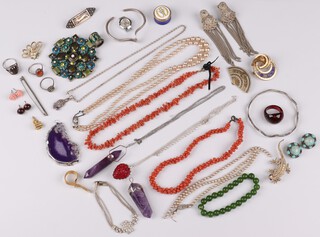 Two amethyst faceted pendants, a silver bangle together with other items of costume jewellery 