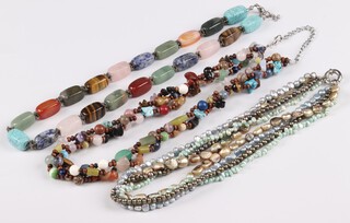 Three strings of carved hardstone beads 