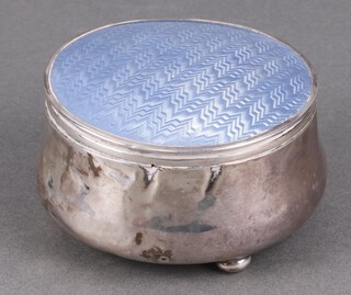 A circular silver and blue guilloche enamel dressing table jar with hinged lid, on bun feet Birmingham 1938 4cm h x 8cm diam. 