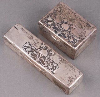 Liberty & Co Cymric, 2 Edwardian embossed silver dressing table boxes with hinged lids 4cm h x 8cm w x 6cm d and 3cm h x 15cm w x 4cm d Birmingham 1905, by Liberty & Co., both marked Cymric 5082 
