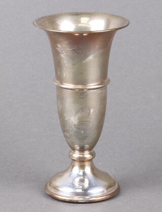 A silver trumpet shaped vase on a weighted spreading foot 13cm, Birmingham 1973 