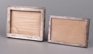 A silver easel photograph frame Birmingham 1934 12cm x 16cm (glass missing) and 1 other 16cm x 13cm (marks rubbed) 