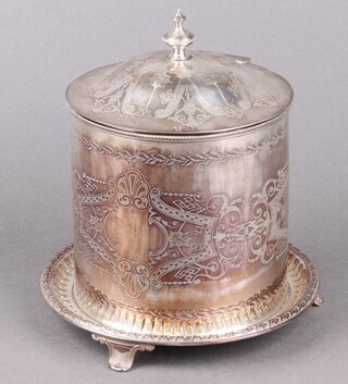 A silver plated biscuit barrel with hinged lid on panelled supports 20cm