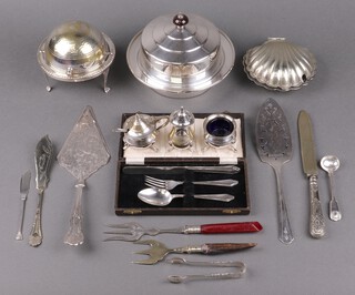 An Art Deco silver plated muffin dish (liner missing), cased silver plated christening set, roll top butter dish, scallop shaped butter dish and other items of silver plate 
